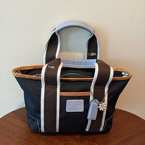 Coach Hampton  mini tote  navy canvas/ tan & Lt blue leather trim
Vinyl interior